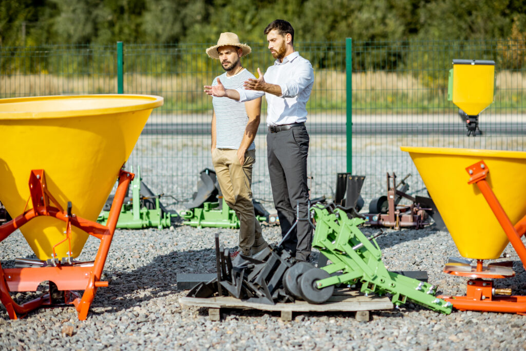 Agronomist with salesman at the agricultural shop
